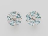 a pair of aquamarinee and diamond earrings