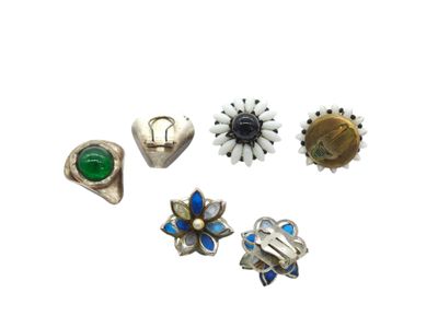 a group of five different colored rings on a white surface