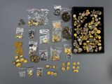 a box filled with lots of gold and silver coins
