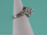 a close up of a diamond ring on a napkin