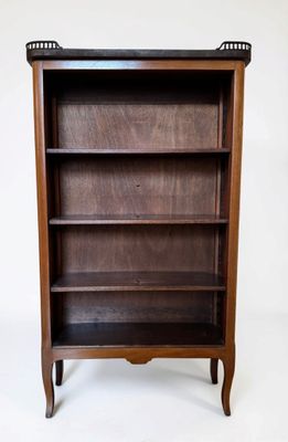 an image of a wooden bookcase with three shelves on top of it