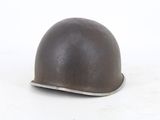 a helmet that is sitting on a white surface