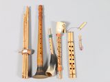 a lot of musical instruments that are laying out on the table