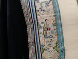 an image of a woman ' s dress with a blue and white design