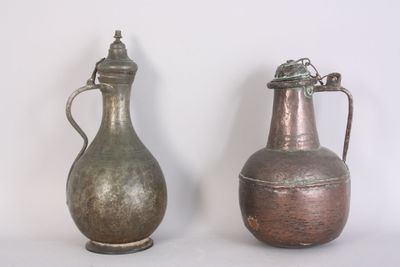 two vases sitting next to each other on a table