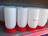 a shelf with several plastic containers on it in a store