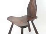 an image of a wooden chair sitting on top of a white floor