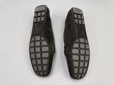men ' s shoes on a white surface with a black and white checkered pattern