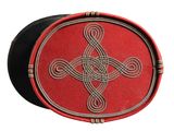a red and black box with a celtic design on it