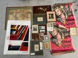 a lot of books and pictures on the floor