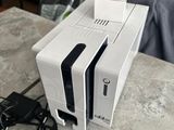 a white printer sitting on top of a table