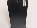 the back of a black cell phone with a sticker on it