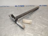 a close up of a hammer on top of a metal table