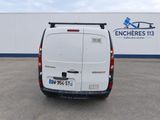 a white van that is parked in a parking lot
