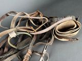 a pair of scissors and a pair of leathers on a table