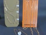 a lot of different necklaces and bracelets on display