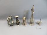 a lot of silver objects sitting on a table