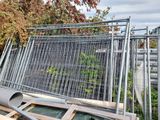a metal fence that has been placed on top of a building