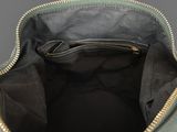 the inside of a green purse with a zipper on it