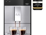 a close up of a coffee machine with two cups of coffee