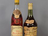 two bottles of liquor sitting next to each other on a table