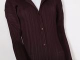 a close up of a mannequin mannequin wearing a maroon jacket