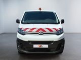 the front of a white van with a red and white stripe on it