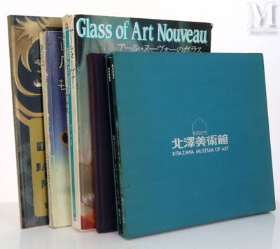 many books that are stacked on top of each other