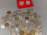 a red box filled with silver and gold coins