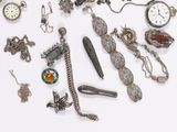 many different types of jewelry on a white surface