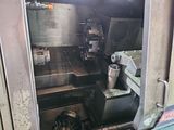 a machine that is working on a piece of metal