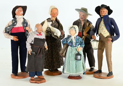 five figurines of people standing in a line