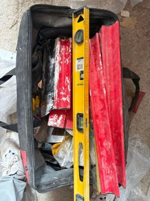 a piece of luggage that has been packed with tools