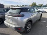 a silver car that is parked in a parking lot
