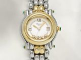 an image of a close up of a wrist watch on a white surface