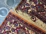 two rugs that are on the floor next to each other