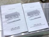 two pages of paper on top of a machine