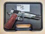 the gun is in the case with the tag on it