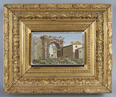 une image représentant un tableau représentant un bâtiment, dans un cadre doré accroché au mur