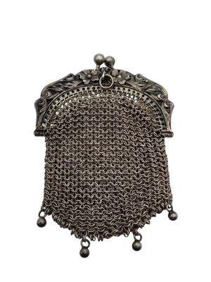 a silver metal purse with a chain around it