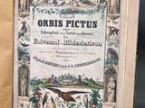 an old book with a picture of animals and birds on it