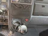 a dashboard of a car with a steering wheel and dashboard controls