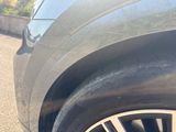 a close up of a car ' s tire on the road