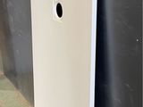 a close up of a white door with a hole in it