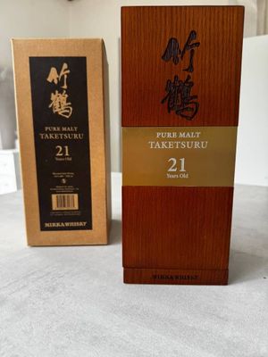 two boxes of sake sake and a box of sake sake on a table