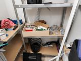 a small room with a lot of tools on the shelves