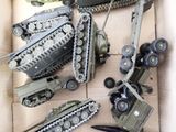 many different types of toy military vehicles in a box