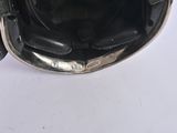 a black helmet on a white table with a white background