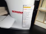 a picture of a white coffee pot with a label on it