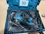 a blue box with tools inside of it on a table